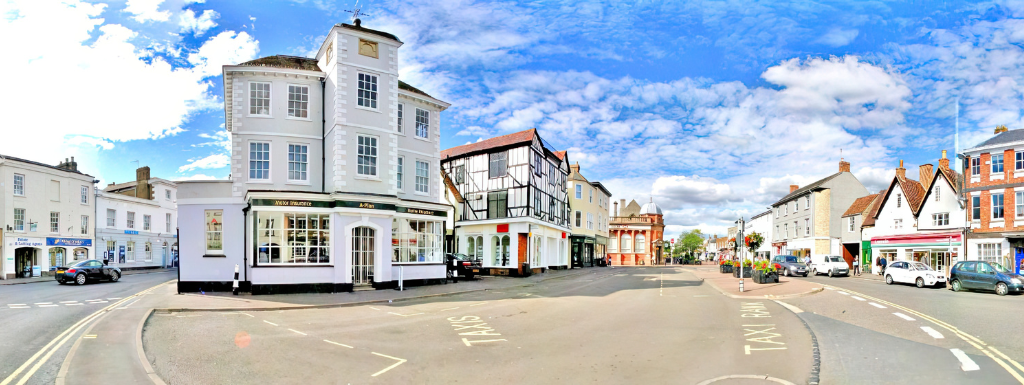 Bicester Market Square detailing shops, business premises and cars